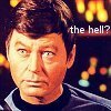 Bones McCoy looking forward, small print "the hell?"